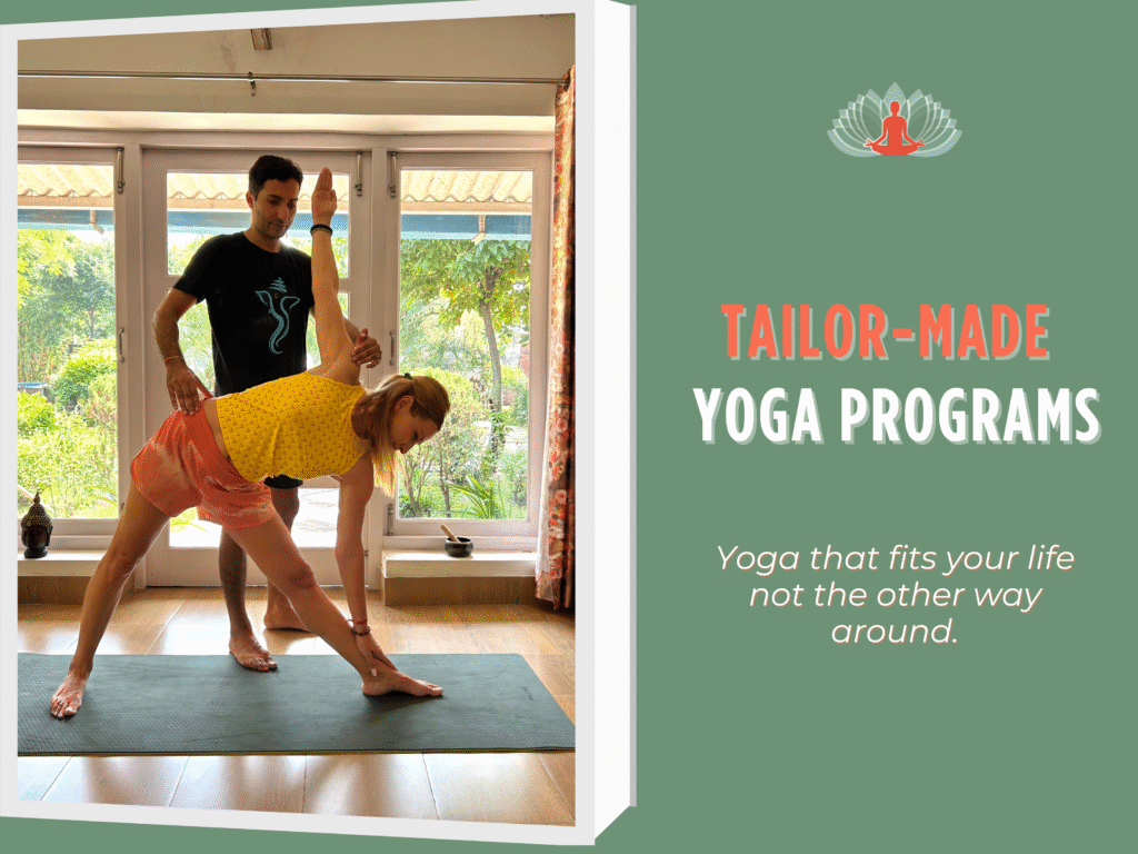 Yoga teacher assisting a student in triangle pose at Akshara Yoga School, rural India — personalized tailor-made yoga program.